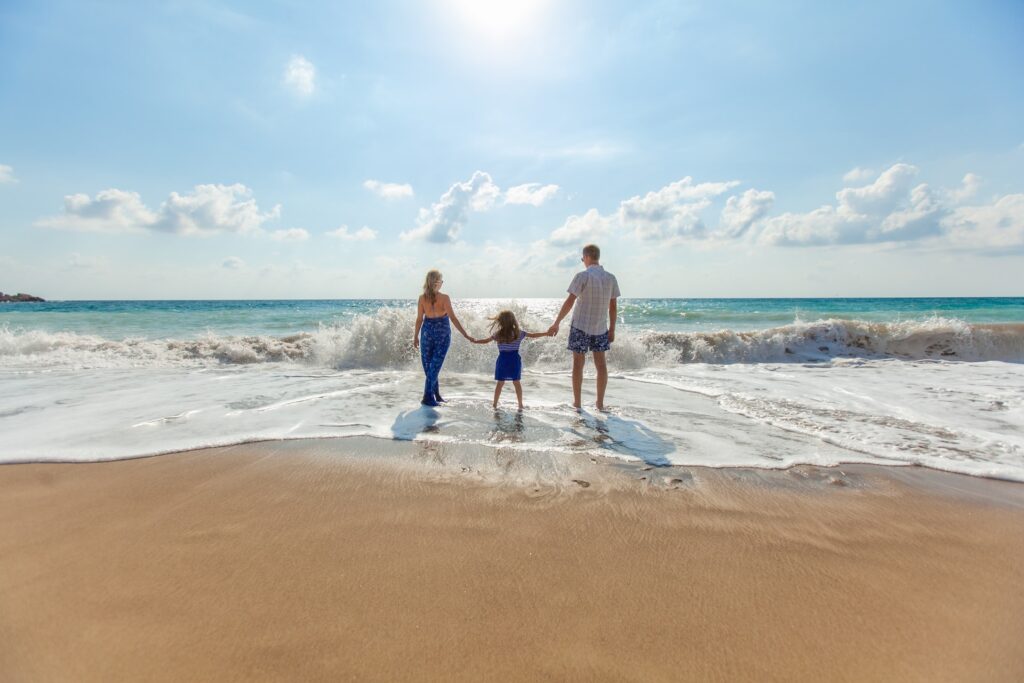 A family enjoying the beach (Success Through Failure episode 306: 14 Tactics Guaranteed to Help You Return from Vacation and Holidays Energized Instead of Exhausted, Driven Not Drained)
