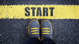 A boy standing at the starting line (Success Through Failure episode 317: Defeating Procrastination: Tactics to Boost Productivity Even When You Don't Feel Like It)