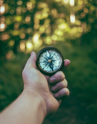 A man holding a compass (Success Through Failure episode 324: Why and How to Create Personal Core Values)