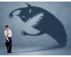 A man, whose shadow is shaped like a monster that's about to attack him (Success Through Failure episode 379: Self-Sabotage: How to Handle Your New Level and Crush Self-Sabotage)